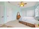 Light and airy bedroom with carpet, ceiling fan, and double door closet storage at 3145 Connemara Dr, Ormond Beach, FL 32174