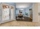 Dining room boasts a modern chandelier, stylish wood flooring, and tasteful decor at 3145 Connemara Dr, Ormond Beach, FL 32174
