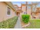 Paver walkway leading to the front entryway of a townhome surrounded by lush greenery at 3145 Connemara Dr, Ormond Beach, FL 32174