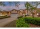 Charming home featuring a Spanish tile roof, landscaped yard, and an attached two-car garage at 3145 Connemara Dr, Ormond Beach, FL 32174