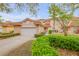 Charming townhome featuring a red tile roof, two-car garage and lush landscaping at 3145 Connemara Dr, Ormond Beach, FL 32174