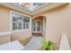 An inviting front entrance features decorative glass doors and tasteful landscaping at 3145 Connemara Dr, Ormond Beach, FL 32174