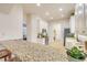 Lovely kitchen with granite counters, stainless appliances, and breakfast bar with archway to dining and living room at 3145 Connemara Dr, Ormond Beach, FL 32174