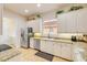 Bright kitchen featuring stainless appliances, granite countertops, and bright white cabinets with under cabinet lighting at 3145 Connemara Dr, Ormond Beach, FL 32174