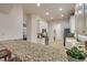 Kitchen with granite countertops, white cabinets, stainless steel appliances, and an open concept design at 3145 Connemara Dr, Ormond Beach, FL 32174