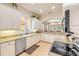 Well-lit kitchen featuring stainless appliances, granite countertops, and under cabinet lighting at 3145 Connemara Dr, Ormond Beach, FL 32174
