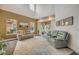 Spacious living room with tall ceilings, large windows, and a sliding door to the patio at 3145 Connemara Dr, Ormond Beach, FL 32174