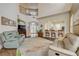 Spacious living room with high ceilings, staircase, and an open-concept view into the kitchen at 3145 Connemara Dr, Ormond Beach, FL 32174