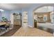 Open-concept living room featuring an archway, large windows, and a high ceiling at 3145 Connemara Dr, Ormond Beach, FL 32174