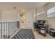 Open upstairs loft featuring desk, chair and railing overlooking downstairs at 3145 Connemara Dr, Ormond Beach, FL 32174