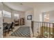 Upstairs loft with desk and chair setup featuring bright windows at 3145 Connemara Dr, Ormond Beach, FL 32174