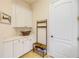 Well-organized mud room with built-in cabinets, coat rack, and convenient shoe storage at 3145 Connemara Dr, Ormond Beach, FL 32174