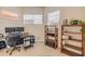 Comfortable office space featuring wood shelving and plenty of natural light at 3145 Connemara Dr, Ormond Beach, FL 32174