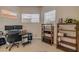 Bright home office space with neutral carpet, desk, and bookshelves at 3145 Connemara Dr, Ormond Beach, FL 32174