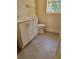Bathroom features a modern vanity with white cabinets and grey tiled floors at 318 S Massachusetts Ave, Deland, FL 32724