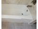 Bathtub with grey tiled floors at 318 S Massachusetts Ave, Deland, FL 32724