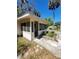 Screened porch with tile floor and access to front entrance at 318 S Massachusetts Ave, Deland, FL 32724