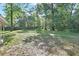 Large lot with mature trees and fenced perimeter at 321 Wade Ave, Deland, FL 32724