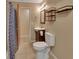 Bathroom featuring a tiled floor, vanity with sink and a mirror, and a toilet at 321 Wade Ave, Deland, FL 32724