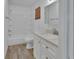 Bathroom featuring a vanity with granite countertop and a shower-tub combo at 321 Wade Ave, Deland, FL 32724