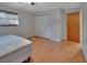 Bedroom featuring hardwood floors and a closet with bi-fold doors at 321 Wade Ave, Deland, FL 32724