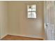 A small empty bedroom that has a window and door at 321 Wade Ave, Deland, FL 32724