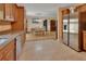 Open kitchen with stainless appliances, tile floors, and an adjacent dining area at 321 Wade Ave, Deland, FL 32724