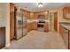 Modern kitchen with stainless steel appliances and tile flooring at 321 Wade Ave, Deland, FL 32724