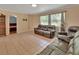 Living room area showcasing tile flooring and furniture at 321 Wade Ave, Deland, FL 32724