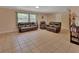 Living room features tile flooring and neutral walls, great for gatherings at 321 Wade Ave, Deland, FL 32724