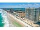Aerial view of beachfront condos with pools, landscaping, and ocean views at 3333 S Atlantic Ave # 2202, Daytona Beach, FL 32118