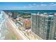 Daytime aerial view captures condo with beach access, pools, and stunning oceanfront location at 3333 S Atlantic Ave # 2202, Daytona Beach, FL 32118