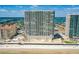 Aerial view of beachfront high-rise condos with beach access, and close to bridge and local amenities at 3333 S Atlantic Ave # 2202, Daytona Beach, FL 32118