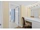 Bright bathroom with a vanity featuring a floral chair, vanity lights and a connecting toilet and shower at 3333 S Atlantic Ave # 2202, Daytona Beach, FL 32118