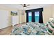 Inviting bedroom with large windows displaying ocean views and a coastal-themed comforter at 3333 S Atlantic Ave # 2202, Daytona Beach, FL 32118