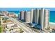 Exterior shot showing the condo's convenient beach access, palm trees, and well-kept landscaping at 3333 S Atlantic Ave # 2202, Daytona Beach, FL 32118