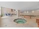 Indoor pool area with a jacuzzi and lounge area at 3333 S Atlantic Ave # 2202, Daytona Beach, FL 32118