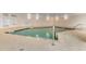 Indoor pool area with pool rules posted and a life preserver hanging on the wall at 3333 S Atlantic Ave # 2202, Daytona Beach, FL 32118