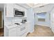 Well-equipped kitchen boasting updated appliances and ample counter space with tile floors at 3333 S Atlantic Ave # 2202, Daytona Beach, FL 32118