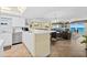 Open-concept living area with kitchen, dining area, and ocean views from the large windows at 3333 S Atlantic Ave # 2202, Daytona Beach, FL 32118