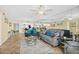 Open-concept living area with tile floors, mirrored wall and comfy furniture at 3333 S Atlantic Ave # 2202, Daytona Beach, FL 32118