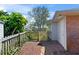 Small fenced backyard featuring a brick paver patio area and privacy fence at 36 Sand Dollar Dr, Ormond Beach, FL 32176