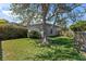 Backyard featuring a big tree, well-kept grass, and a private fence at 36 Sand Dollar Dr, Ormond Beach, FL 32176