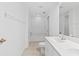 Bright bathroom featuring dual sinks, walk-in shower, and updated fixtures at 36 Sand Dollar Dr, Ormond Beach, FL 32176