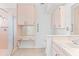 Traditional bathroom featuring built-in vanity, storage, and walk-in shower with peach tile at 36 Sand Dollar Dr, Ormond Beach, FL 32176