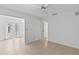Spacious bedroom featuring neutral paint, tile floors, and a ceiling fan at 36 Sand Dollar Dr, Ormond Beach, FL 32176