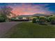 Beautifully landscaped front yard and long brick driveway leading to the home's front entrance at 36 Sand Dollar Dr, Ormond Beach, FL 32176