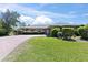 Beautiful single-story home featuring a brick driveway and well-manicured landscaping at 36 Sand Dollar Dr, Ormond Beach, FL 32176