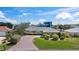 Charming single-story home with a brick driveway and lush green lawn at 36 Sand Dollar Dr, Ormond Beach, FL 32176