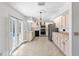 Modern kitchen with black appliances, bright cabinets, and tiled floor at 36 Sand Dollar Dr, Ormond Beach, FL 32176